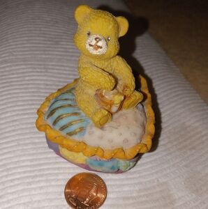 Tiny little Honey Teddy Bear  sitting on his little Trinket box.